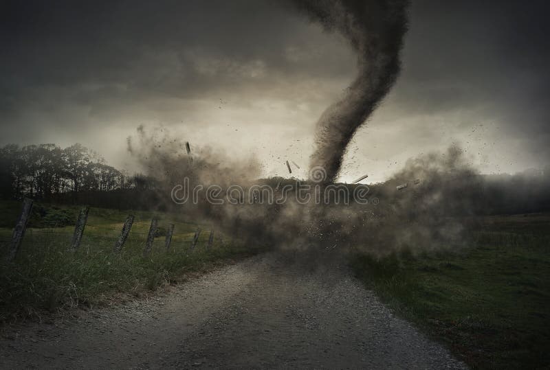 A tornado spins down on a gravel road and destroys a fence. A tornado spins down on a gravel road and destroys a fence.