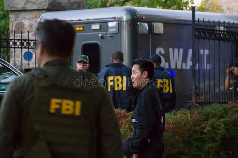 TORONTO, CANADA - 10 09 2018: Actors wearing FBI uniform and a S.W.A.T truck beside the Spafina museum during the filming of the FBI TV series epsode. TORONTO, CANADA - 10 09 2018: Actors wearing FBI uniform and a S.W.A.T truck beside the Spafina museum during the filming of the FBI TV series epsode.