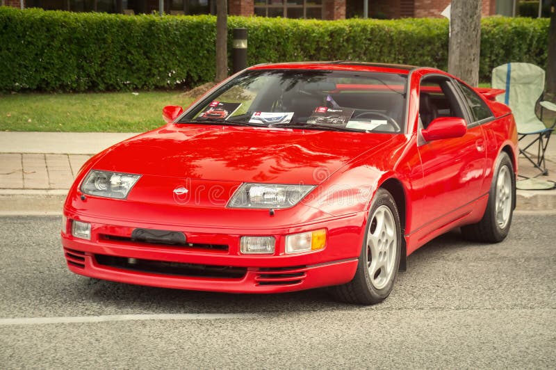 TORONTO, CANADA - 08 18 2018: Red 1990 Nissan 300ZX Z32 coupe oldtimer sports car made by Japanese automaker Nissan Motor Co., Ltd on display at auto show Wheels on the Danforth. TORONTO, CANADA - 08 18 2018: Red 1990 Nissan 300ZX Z32 coupe oldtimer sports car made by Japanese automaker Nissan Motor Co., Ltd on display at auto show Wheels on the Danforth