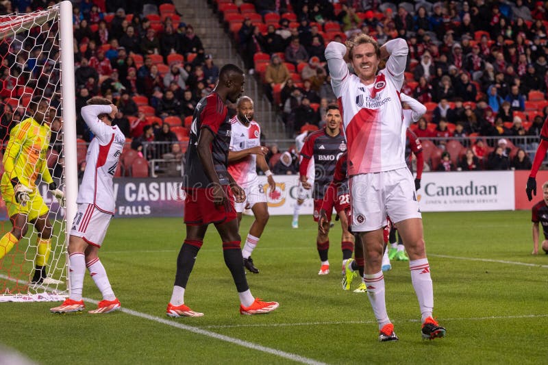 Toronto, ON, Canada - April 20, 2024: Henry Kessler #4 defender of the New England Revolution reacts to a missed ball during the MLS Regular Season match between Toronto FC (Canada) and New England Revolution (USA) at BMO Field. Toronto, ON, Canada - April 20, 2024: Henry Kessler #4 defender of the New England Revolution reacts to a missed ball during the MLS Regular Season match between Toronto FC (Canada) and New England Revolution (USA) at BMO Field