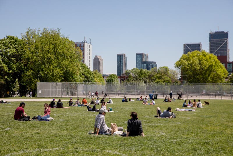 People hang out at Trinity Bellwoods Park, sitting in `Social Distancing Circles`. The circles have a diameter of eight feet and are being placed 10 feet apart to ensure physical distancing among park goers, during COVID-19 pandemic. People hang out at Trinity Bellwoods Park, sitting in `Social Distancing Circles`. The circles have a diameter of eight feet and are being placed 10 feet apart to ensure physical distancing among park goers, during COVID-19 pandemic.