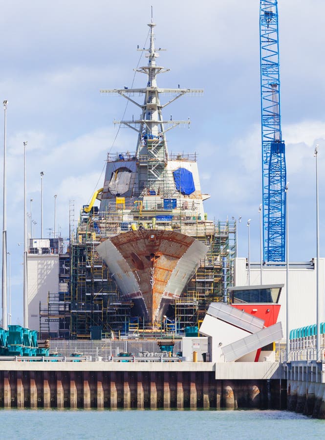 Modern destroyer under construction in a naval shipyard. Modern destroyer under construction in a naval shipyard