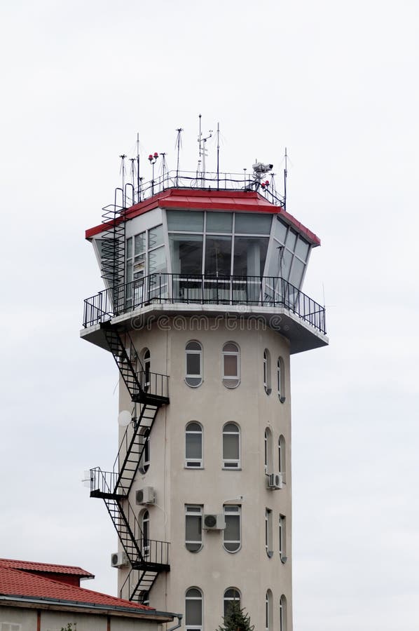 This photograph represent the control tower of an airport. This photograph represent the control tower of an airport