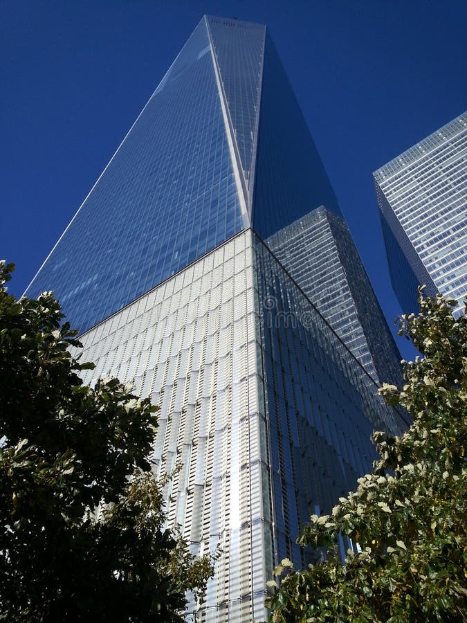 One World Trade Center (also known as One World Trade,One WTC,and formerly Freedom Tower)[note 1] is the main building of the rebuilt World Trade Center complex in Lower Manhattan,New York City. One WTC is the tallest building in the United States,the tallest building in the Western Hemisphere,and the sixth-tallest in the world. The supertall structure has the same name as the North Tower of the original World Trade Center,which was destroyed in the terrorist attacks of September 11,2001. The new skyscraper stands on the northwest corner of the 16-acre (6.5 ha) World Trade Center site,on the site of the original 6 World Trade Center. The building is bounded by West Street to the west,Vesey Street to the north,Fulton Street to the south,and Washington Street to the east.The building's architect is David Childs,whose firm Skidmore,Owings & Merrill (SOM) also designed the Burj Khalifa and the Willis Tower. The construction of below-ground utility relocations,footings,and foundations for the new building began on April 27,2006. One World Trade Center became the tallest structure in New York City on April 30,2012,when it surpassed the height of the Empire State Building. The tower's steel structure was topped out on August 30,2012. On May 10,2013,the final component of the skyscraper's spire was installed,making the building,including its spire,reach a total height of 1,776 feet (541 m). Its height in feet is a deliberate reference to the year when the United States Declaration of Independence was signed. The building opened on November 3,2014 [14] the One World Observatory opened on May 29,2015.[15]On March 26,2009,the Port Authority of New York and New Jersey (PANYNJ) confirmed that the building would be officially known by its legal name of "One World Trade Center",rather than its colloquial name of "Freedom Tower".[16][17][18] The building has 94 stories,with the top floor numbered 104.The new World Trade Center complex will eventually include five high-rise office buildings built along Greenwich Street,as well as the National September 11 Memorial & Museum,located just south of One World Trade Center where the original Twin Towers stood. The construction of the new building is part of an effort to memorialize and rebuild following the destruction of the original World Trade Center complex. One World Trade Center (also known as One World Trade,One WTC,and formerly Freedom Tower)[note 1] is the main building of the rebuilt World Trade Center complex in Lower Manhattan,New York City. One WTC is the tallest building in the United States,the tallest building in the Western Hemisphere,and the sixth-tallest in the world. The supertall structure has the same name as the North Tower of the original World Trade Center,which was destroyed in the terrorist attacks of September 11,2001. The new skyscraper stands on the northwest corner of the 16-acre (6.5 ha) World Trade Center site,on the site of the original 6 World Trade Center. The building is bounded by West Street to the west,Vesey Street to the north,Fulton Street to the south,and Washington Street to the east.The building's architect is David Childs,whose firm Skidmore,Owings & Merrill (SOM) also designed the Burj Khalifa and the Willis Tower. The construction of below-ground utility relocations,footings,and foundations for the new building began on April 27,2006. One World Trade Center became the tallest structure in New York City on April 30,2012,when it surpassed the height of the Empire State Building. The tower's steel structure was topped out on August 30,2012. On May 10,2013,the final component of the skyscraper's spire was installed,making the building,including its spire,reach a total height of 1,776 feet (541 m). Its height in feet is a deliberate reference to the year when the United States Declaration of Independence was signed. The building opened on November 3,2014 [14] the One World Observatory opened on May 29,2015.[15]On March 26,2009,the Port Authority of New York and New Jersey (PANYNJ) confirmed that the building would be officially known by its legal name of "One World Trade Center",rather than its colloquial name of "Freedom Tower".[16][17][18] The building has 94 stories,with the top floor numbered 104.The new World Trade Center complex will eventually include five high-rise office buildings built along Greenwich Street,as well as the National September 11 Memorial & Museum,located just south of One World Trade Center where the original Twin Towers stood. The construction of the new building is part of an effort to memorialize and rebuild following the destruction of the original World Trade Center complex.