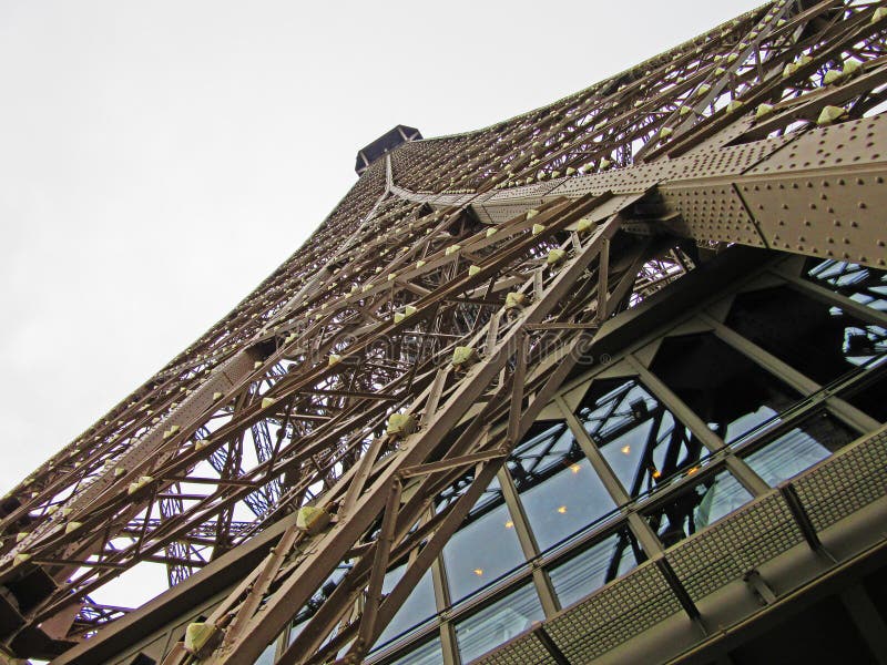 The Eiffel Tower is an iron lattice tower located on the Champ de Mars in Paris. It was named after the engineer Gustave Eiffel, whose company designed and built the tower. Erected in 1889 as the entrance arch to the 1889 World's Fair, it was initially criticized by some of France's leading artists and intellectuals for its design, but has become both a global cultural icon of France and one of the most recognizable structures in the world. The tower is the tallest structure in Paris and the most-visited paid monument in the world. The tower is 324 meters (1,063 ft.) tall, about the same height as an 81-storey building. During its construction, the Eiffel Tower surpassed the Washington Monument to assume the title of the tallest man-made structure in the world, a title it held for 41 years, until the Chrysler Building in New York City was built in 1930. It is the second-tallest structure in France, after the Millau Viaduct. The tower has three levels for visitors, with restaurants on the first and second. The third level observatory's upper platform is 276 m (906 ft.) above the ground, the highest accessible to the public in the European Union. The climb from ground level to the first level is over 300 steps, as is the walk from the first to the second level. Although there are stairs to the third and highest level, these are usually closed to the public and it is generally only accessible by lift. The Eiffel Tower is an iron lattice tower located on the Champ de Mars in Paris. It was named after the engineer Gustave Eiffel, whose company designed and built the tower. Erected in 1889 as the entrance arch to the 1889 World's Fair, it was initially criticized by some of France's leading artists and intellectuals for its design, but has become both a global cultural icon of France and one of the most recognizable structures in the world. The tower is the tallest structure in Paris and the most-visited paid monument in the world. The tower is 324 meters (1,063 ft.) tall, about the same height as an 81-storey building. During its construction, the Eiffel Tower surpassed the Washington Monument to assume the title of the tallest man-made structure in the world, a title it held for 41 years, until the Chrysler Building in New York City was built in 1930. It is the second-tallest structure in France, after the Millau Viaduct. The tower has three levels for visitors, with restaurants on the first and second. The third level observatory's upper platform is 276 m (906 ft.) above the ground, the highest accessible to the public in the European Union. The climb from ground level to the first level is over 300 steps, as is the walk from the first to the second level. Although there are stairs to the third and highest level, these are usually closed to the public and it is generally only accessible by lift.