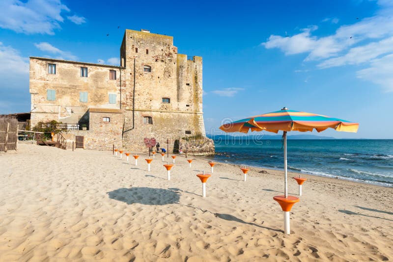 Torre Mozza old tower and beach in Tuscany stock photo Torre Mozza old tower and beach in Tuscany stock photo