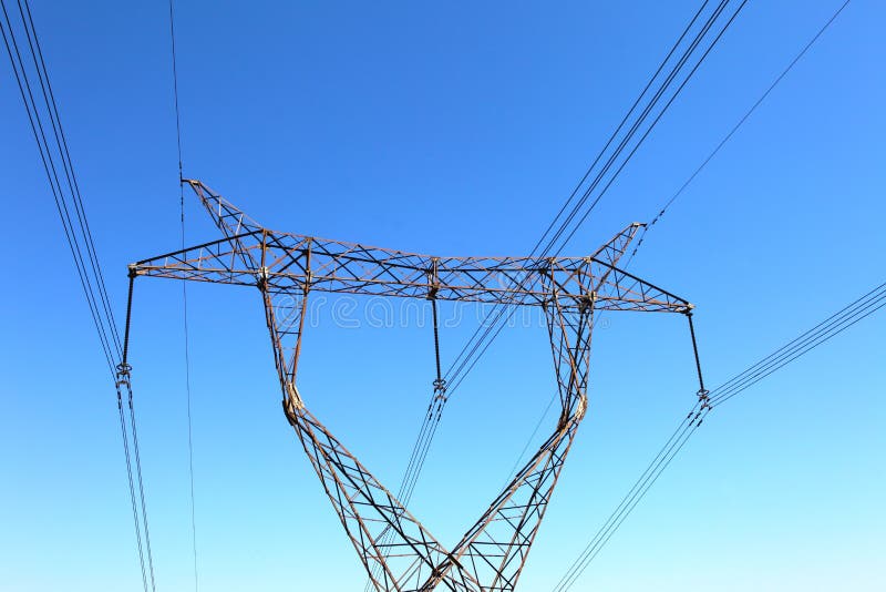 Power transmission tower on background blue sky. Power transmission tower on background blue sky.