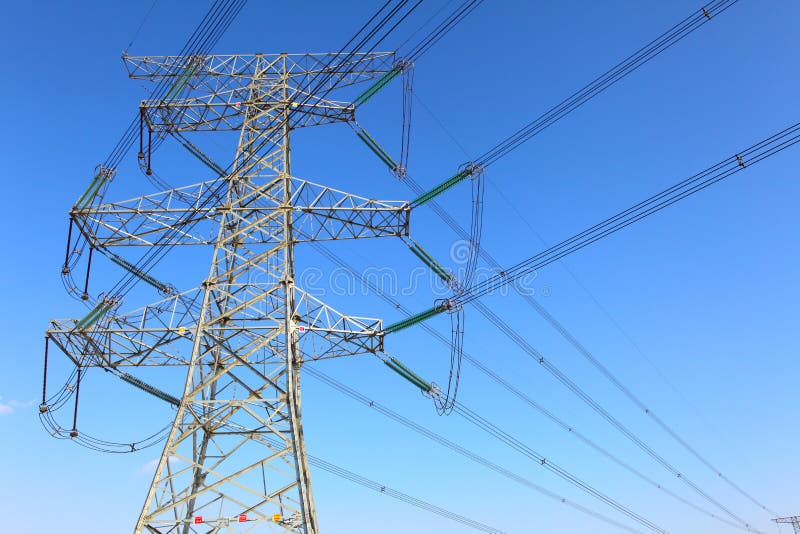 Power transmission tower on background blue sky. Power transmission tower on background blue sky.