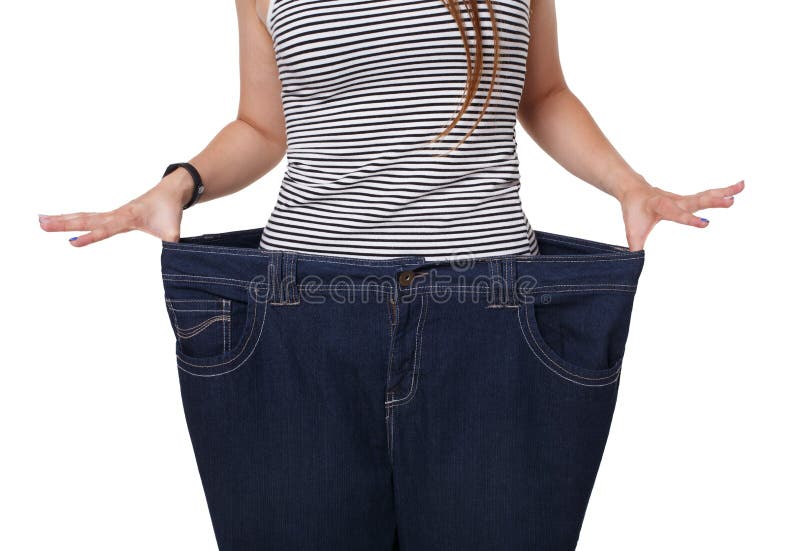 Torso irreconhecível da mulher, mostrando resultados da dieta isolado no branco imagem de stock Torso irreconhecível da mulher, mostrando resultados da dieta isolado no branco imagem de stock