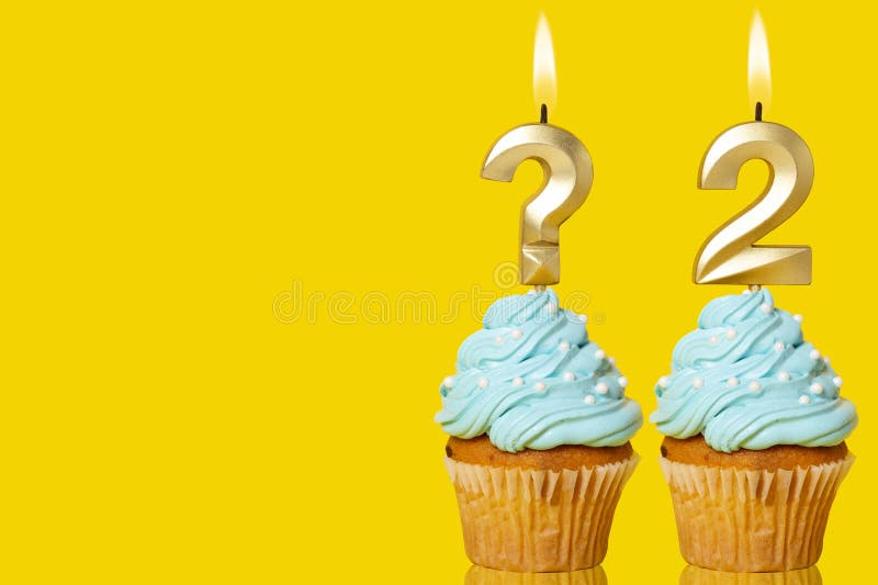 Birthday Cake with Lit Question Mark Candle and Number 2 - Photo on Yellow Background. Birthday Cake with Lit Question Mark Candle and Number 2 - Photo on Yellow Background