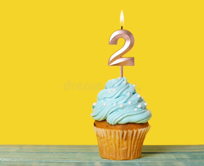 Birthday Cake With Candle Number 2 - On Yellow Background. Birthday Cake With Candle Number 2 - On Yellow Background.