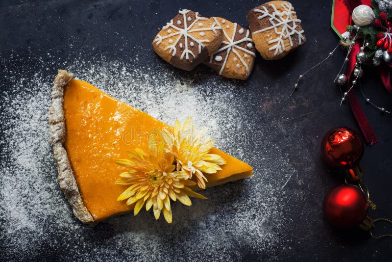 Pumpkin pie with cookies and Christmas decoration. top view. Pumpkin pie with cookies and Christmas decoration. top view