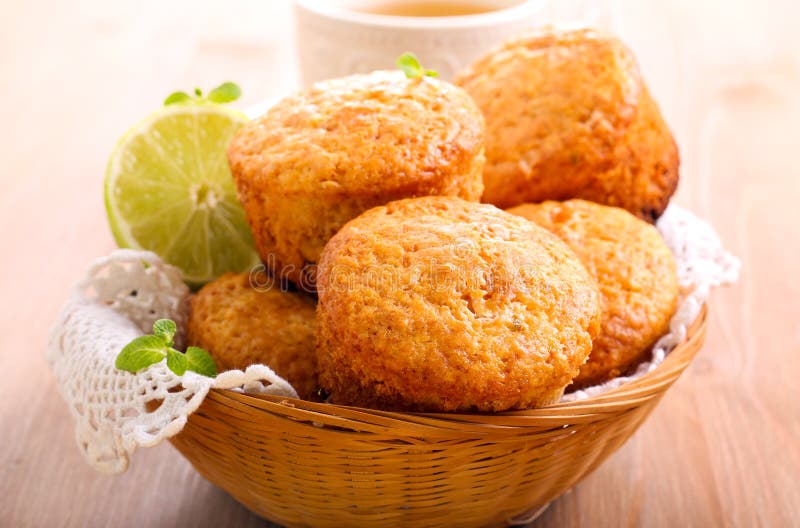 Lime cakes in basket and cup of tea. Lime cakes in basket and cup of tea