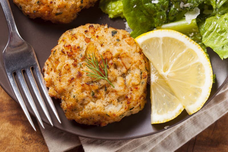 Organic Homemade Crab Cakes with Lemon and Tartar Sauce. Organic Homemade Crab Cakes with Lemon and Tartar Sauce