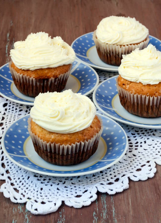 Four Coconut cakes with frosting. Four Coconut cakes with frosting