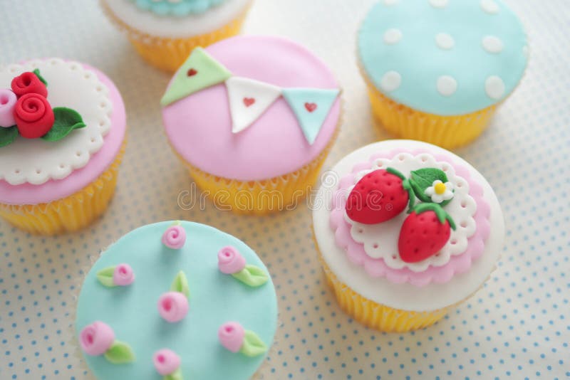 Strawberry and pink rose fondant cup cakes. Strawberry and pink rose fondant cup cakes.