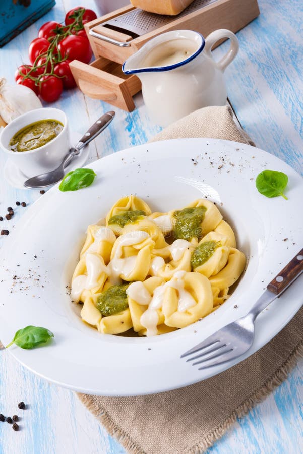 A Tortellini Di Formaggio with Basil Pesto and Cheese Sauce Stock Image ...