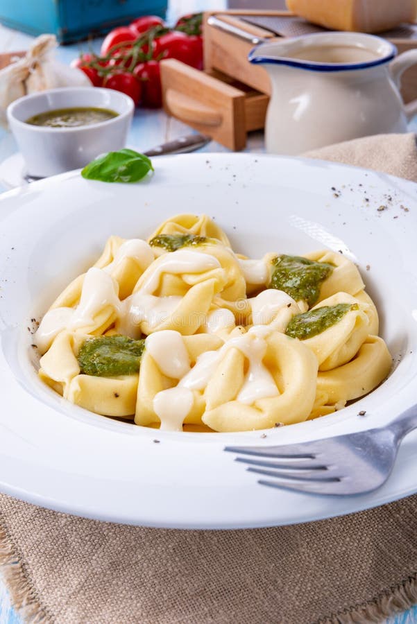 Tortellini Di Formaggio with Basil Pesto and Cheese Sauce Stock Image ...