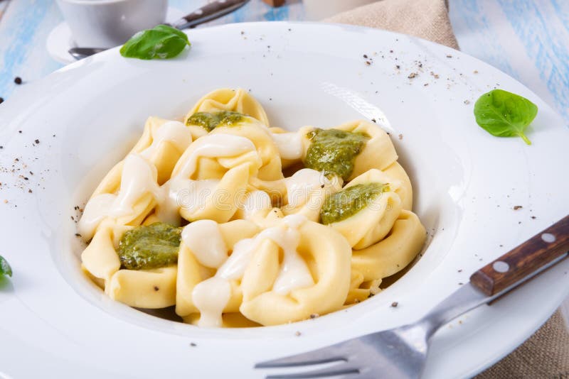 A Tortellini Di Formaggio with Basil Pesto and Cheese Sauce Stock Image ...