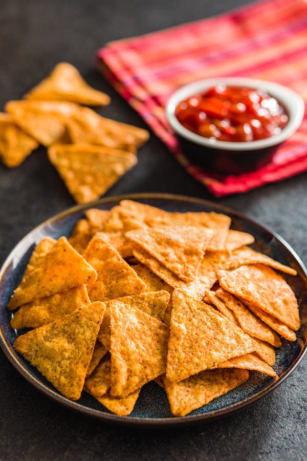 Tortilla Chips with the Flavor of Chili Peppers on Plate Stock Image
