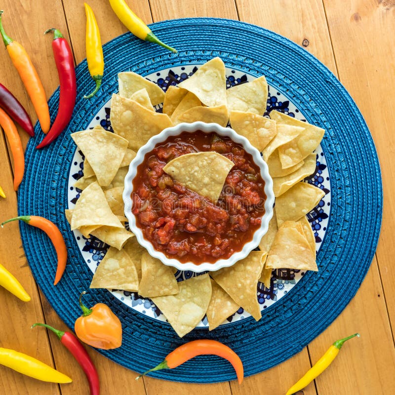 Tortilla Chips and Salsa with Chilli Peppers To the Left and Copy Space