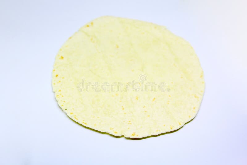 Flour tortilla isolated over a light grey background. Flour tortilla isolated over a light grey background