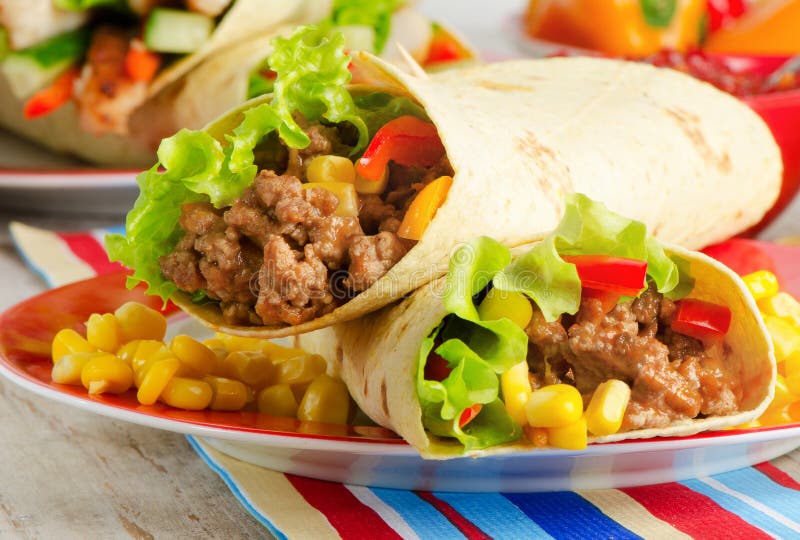Tortilla wraps with meat and fresh vegetables. Tortilla wraps with meat and fresh vegetables