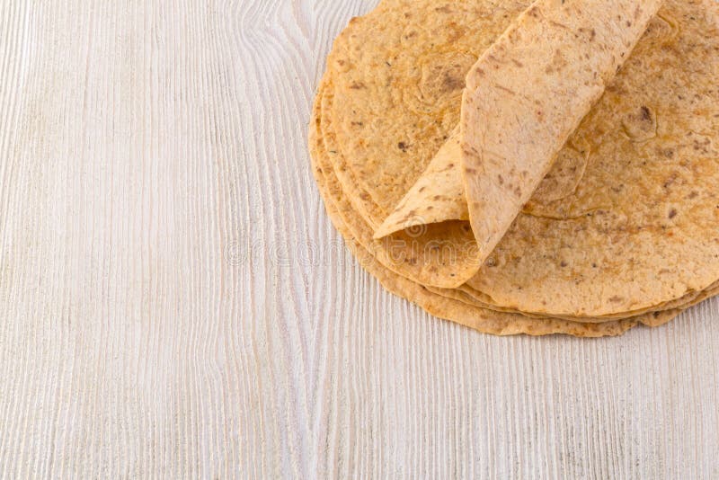 Tortilla on wooden table background. Tortilla on wooden table background