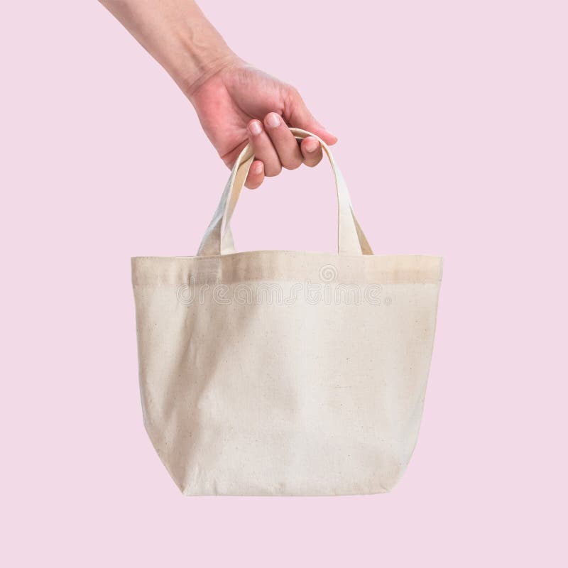 Tote bag canvas white cotton fabric cloth for eco shoulder shopping sack mockup blank template isolated on pink background