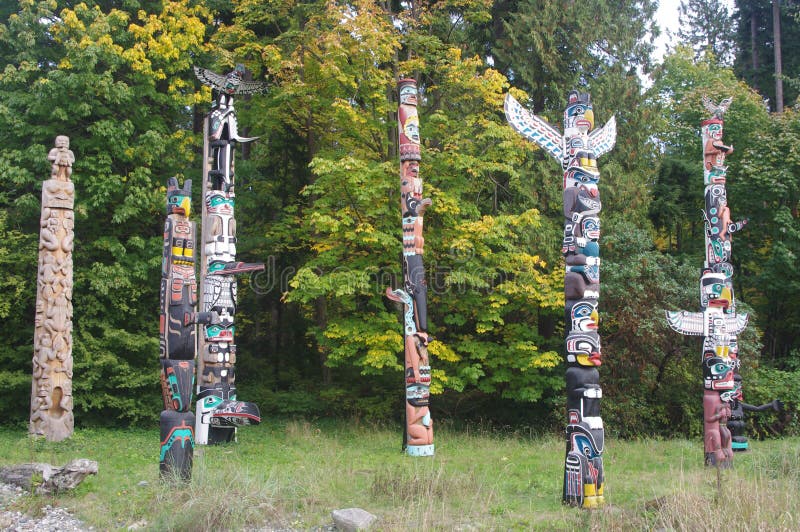Totem poles in Stanley Park stock photo Totem poles in Stanley Park stock photo