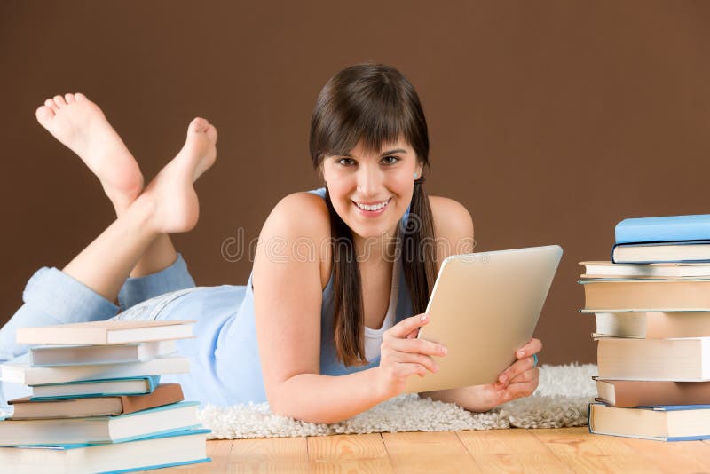 Touch screen computer - woman teenager study royalty free stock photography