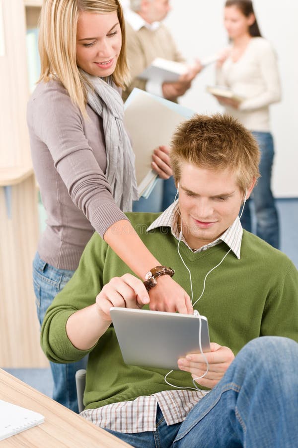 Touch screen tablet computer - students in library