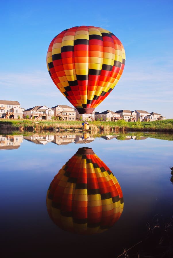 Hot Air Balloon Touching The Water Picture. Image 4377553