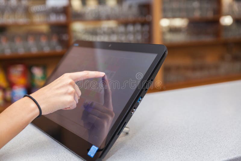 Touchscreen`s cash register in the restaurant. Screen, touching.