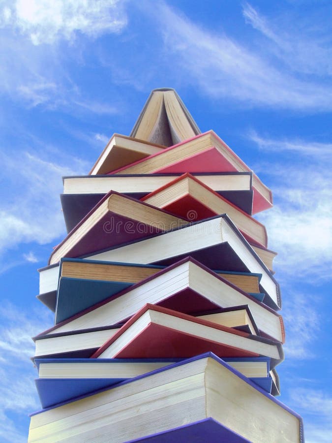 A tower made of books, seen against a bright sky. A tower made of books, seen against a bright sky.