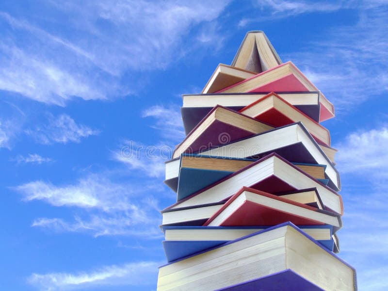 A tower made of books, seen against a bright sky. A tower made of books, seen against a bright sky.