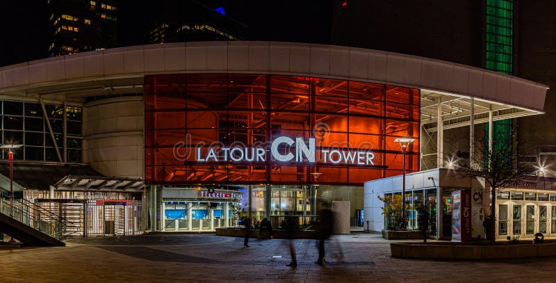 The tour entrance to CN tower Toronto at night, surrounding buildings and walkway. The tour entrance to CN tower Toronto at night, surrounding buildings and walkway.