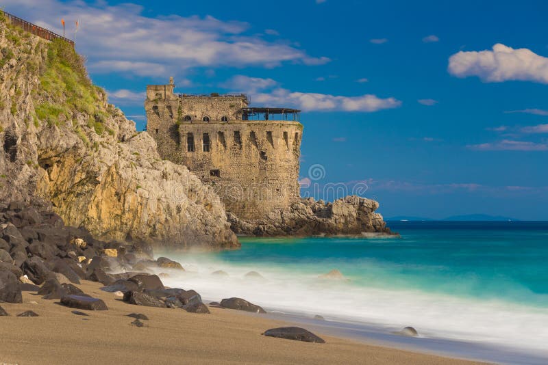 Medieval tower on the coast of Maiori town, blurred sea waves effect, Amalfi coast, Campania region, Italy. Medieval tower on the coast of Maiori town, blurred sea waves effect, Amalfi coast, Campania region, Italy