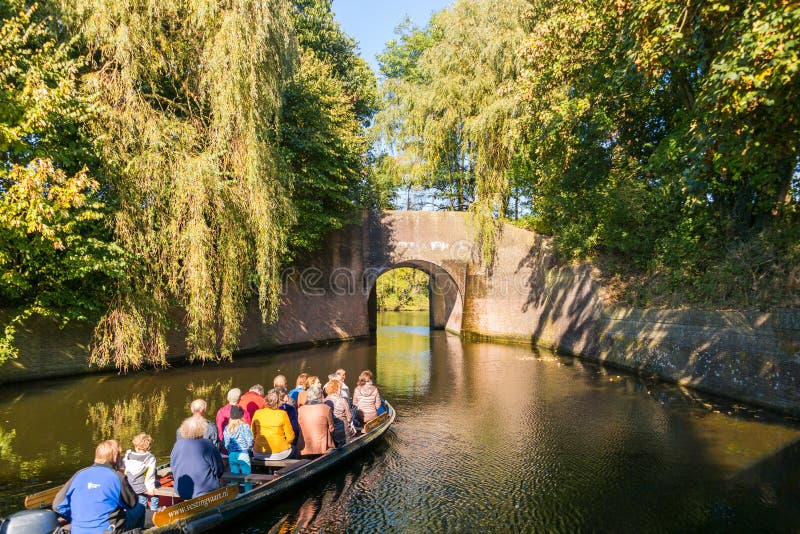 Tourboat and bridge over canal in Naarden, Netherlands