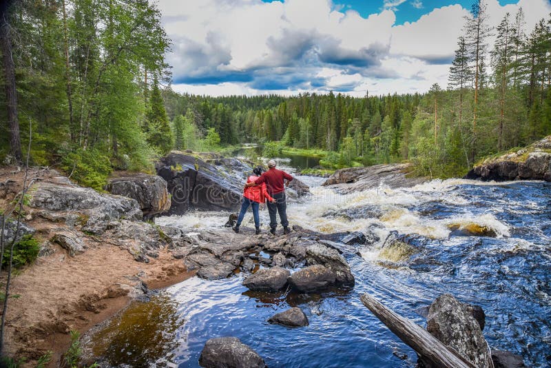 Tourism. People travel around Karelia. Trips to Russia. Kumi Threshold Falls.