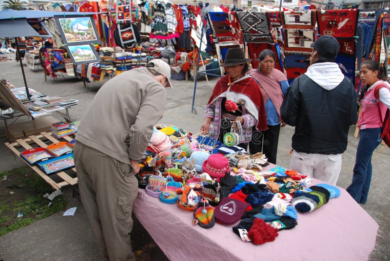 Ecuadorian people in a local market of SaquisilÃ­. SaquisilÃ­ is a town in the Cotopaxi Province of Ecuador. It is the seat of the SaquisilÃ­ Canton. SasquisilÃ­ is located about 25 minutes from Latacunga and 2.5 hours from Quito. The town, located off the Pan-American Highway, is best known for the local market held in its eight plazas on Thursdays. Unlike Otavalo, the market is mainly for locals from the highlands who come to buy pots and pans, electronics, herbal remedies, livestock or produce. To go to the animal market, arrive between 7 and 9 a.m. Ecuadorian people in a local market of SaquisilÃ­. SaquisilÃ­ is a town in the Cotopaxi Province of Ecuador. It is the seat of the SaquisilÃ­ Canton. SasquisilÃ­ is located about 25 minutes from Latacunga and 2.5 hours from Quito. The town, located off the Pan-American Highway, is best known for the local market held in its eight plazas on Thursdays. Unlike Otavalo, the market is mainly for locals from the highlands who come to buy pots and pans, electronics, herbal remedies, livestock or produce. To go to the animal market, arrive between 7 and 9 a.m.