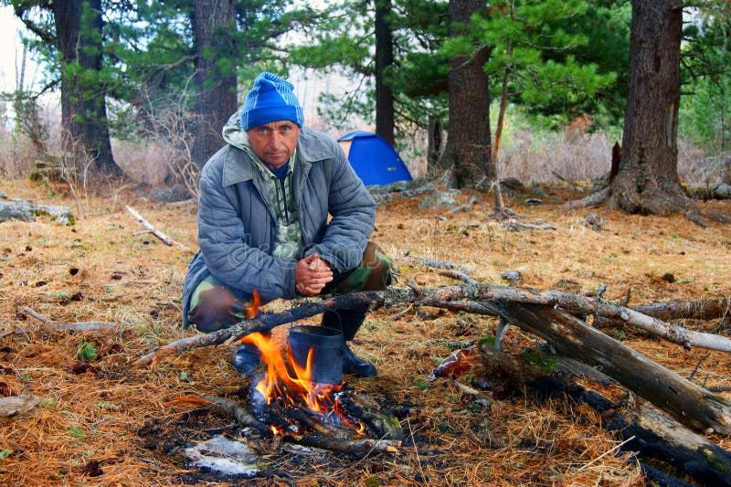 Tourist beside campfires