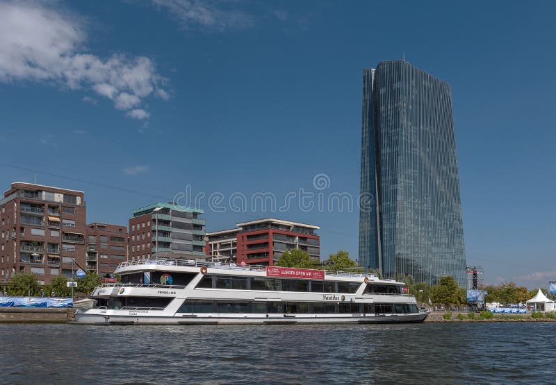 Tourist cruise boat on the Main river in front of the building of the European Central Bank, Frankfurt, Germany