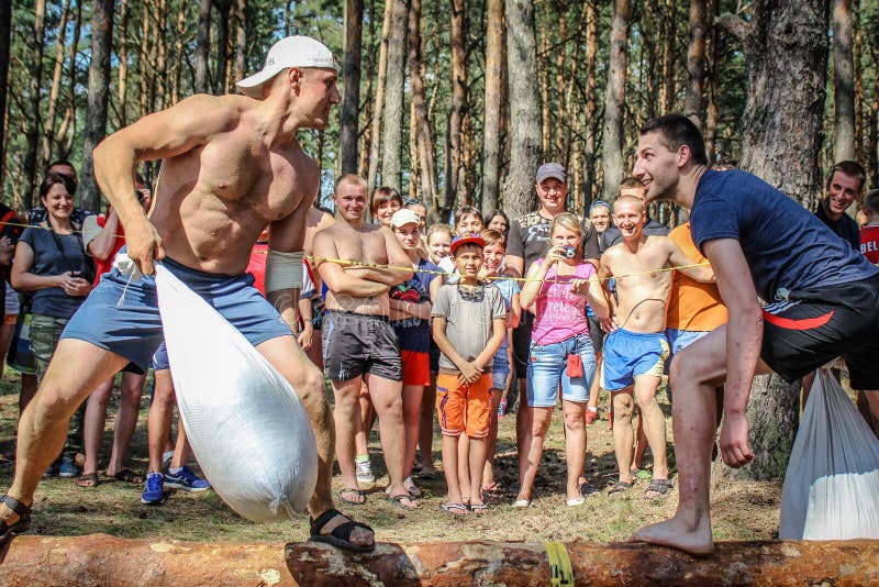 The tourist rally of young people in the Gomel region of the Republic of Belarus. In the Gomel region each year, the tourist gathering where compete teams from all districts of the region. At the event youth teams compete in the tourism job, sports competitions, tug of war, beach volleyball and other disciplines. Each year the forum is held in different areas, in the most picturesque places and lasts about three days, and then summarizes the events and determined the winning team. This shot taken during a summer tourist gathering in 2017.