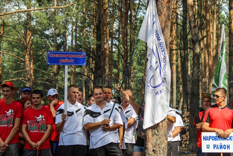 The tourist rally of young people in the Gomel region of the Republic of Belarus. In the Gomel region each year, the tourist gathering where compete teams from all districts of the region. At the event youth teams compete in the tourism job, sports competitions, tug of war, beach volleyball and other disciplines. Each year the forum is held in different areas, in the most picturesque places and lasts about three days, and then summarizes the events and determined the winning team. This shot taken during a summer tourist gathering in 2017.