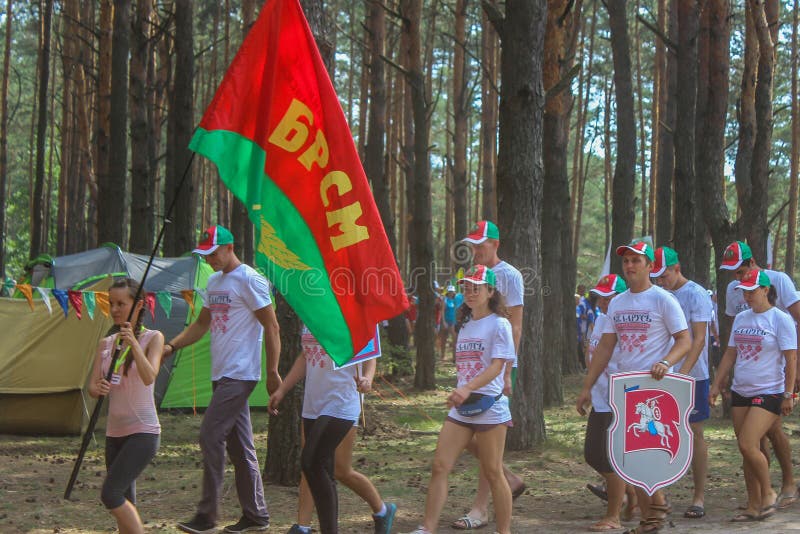 The tourist rally of young people in the Gomel region of the Republic of Belarus. In the Gomel region each year, the tourist gathering where compete teams from all districts of the region. At the event youth teams compete in the tourism job, sports competitions, tug of war, beach volleyball and other disciplines. Each year the forum is held in different areas, in the most picturesque places and lasts about three days, and then summarizes the events and determined the winning team. This shot taken during a summer tourist gathering in 2017.