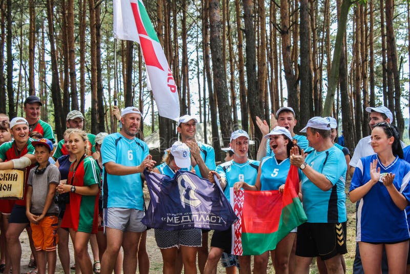 The tourist rally of young people in the Gomel region of the Republic of Belarus. In the Gomel region each year, the tourist gathering where compete teams from all districts of the region. At the event youth teams compete in the tourism job, sports competitions, tug of war, beach volleyball and other disciplines. Each year the forum is held in different areas, in the most picturesque places and lasts about three days, and then summarizes the events and determined the winning team. This shot taken during a summer tourist gathering in 2017.