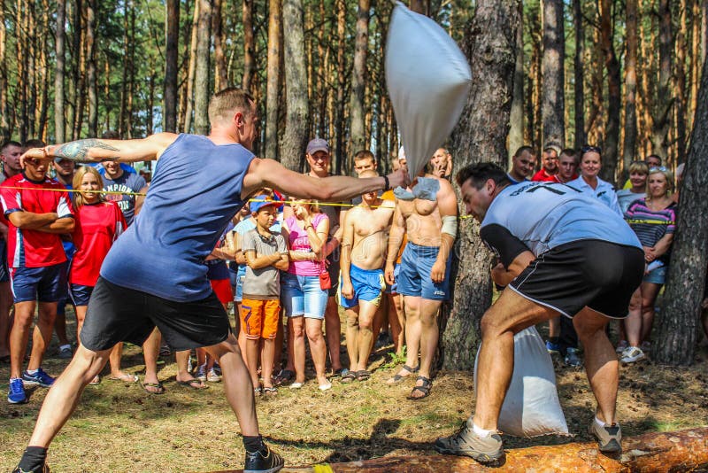 The tourist rally of young people in the Gomel region of the Republic of Belarus. In the Gomel region each year, the tourist gathering where compete teams from all districts of the region. At the event youth teams compete in the tourism job, sports competitions, tug of war, beach volleyball and other disciplines. Each year the forum is held in different areas, in the most picturesque places and lasts about three days, and then summarizes the events and determined the winning team. This shot taken during a summer tourist gathering in 2017.