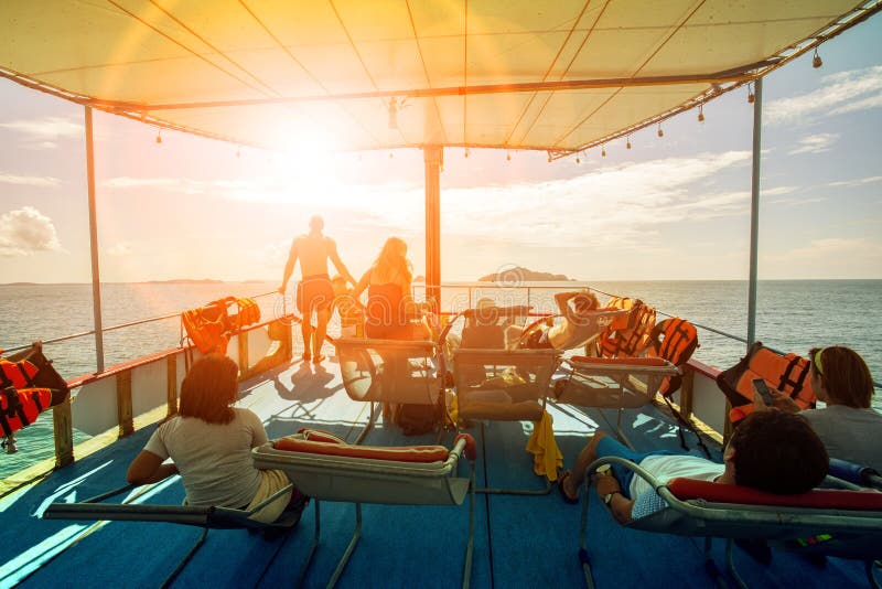 Tourist relaxing on cruising ship roof and sun light skies ahead