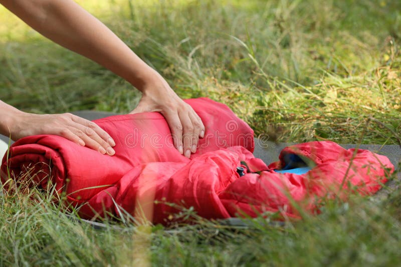 Tourist Rolling Red Sleeping Bag Outdoors, Closeup Stock Photo Image